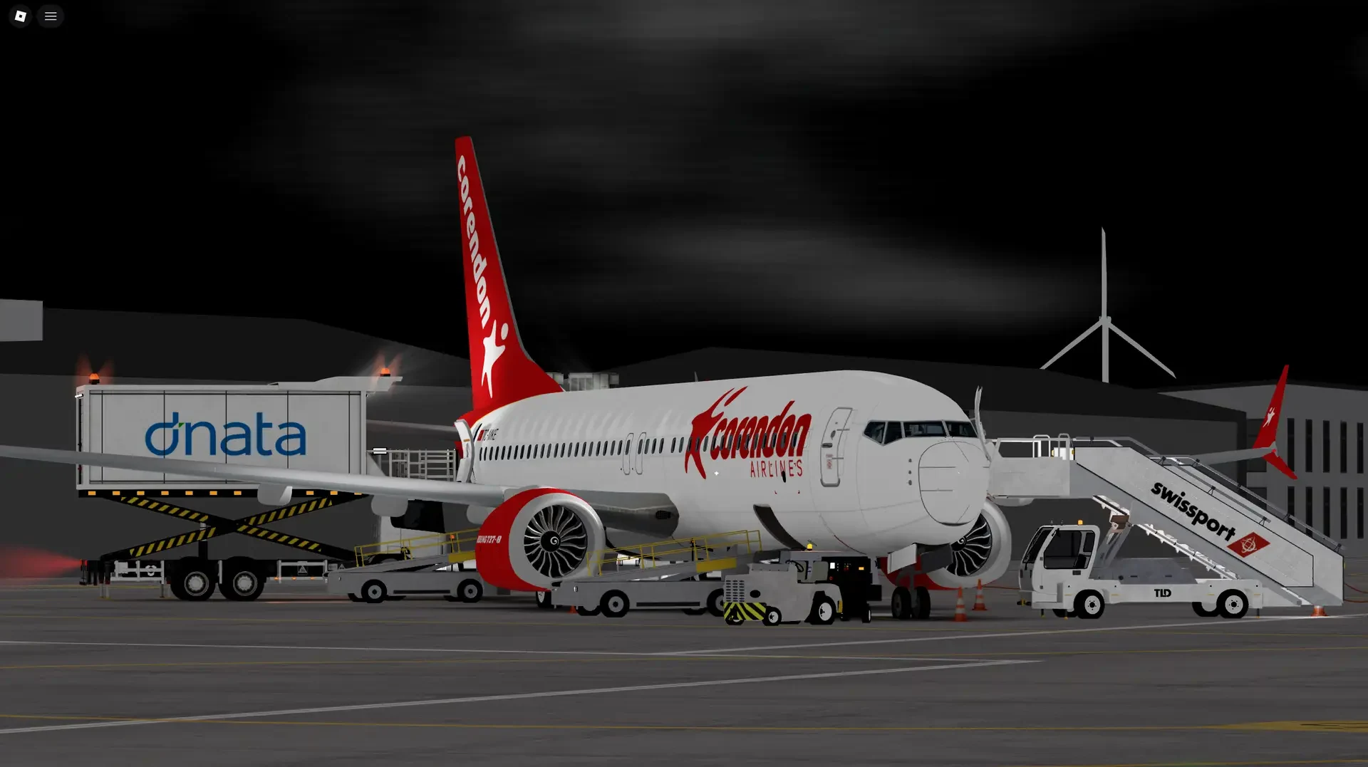 Corendon Airlines Roblox aircraft being prepared on the apron at night