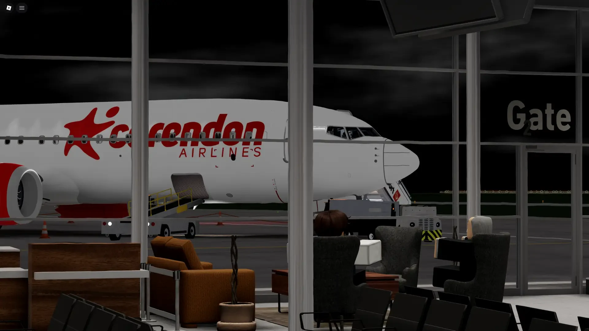 Corendon aircraft viewed from the airport terminal at night